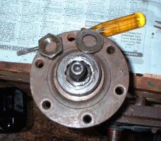 Early style half-shaft and drive flange, after removal of splitpin, nut and washer.JPG